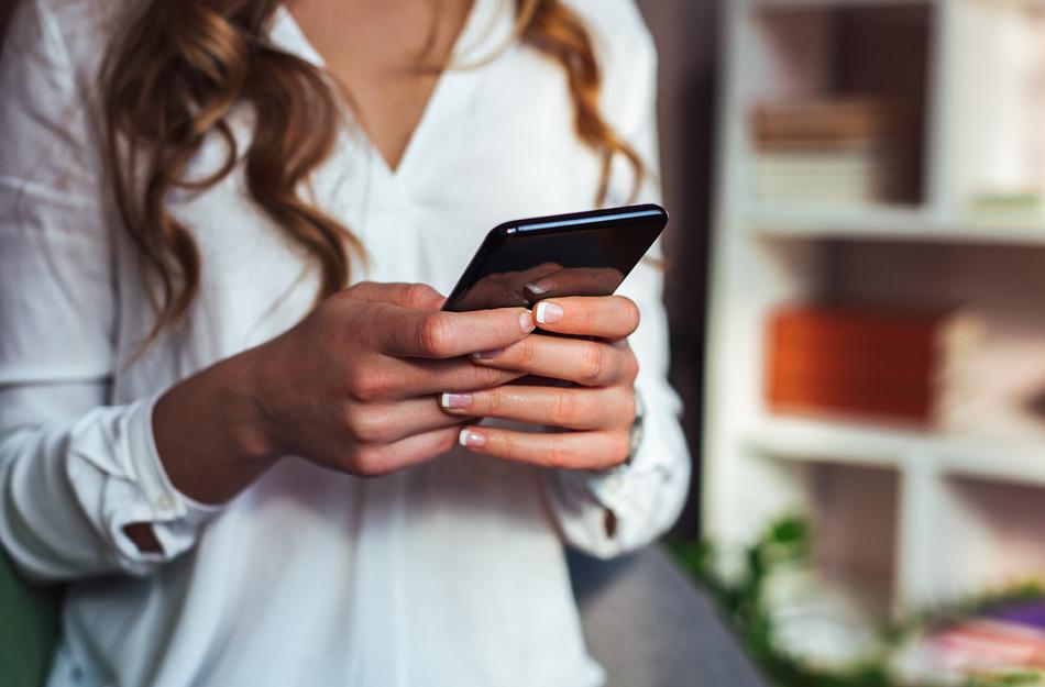 woman looking at her phone